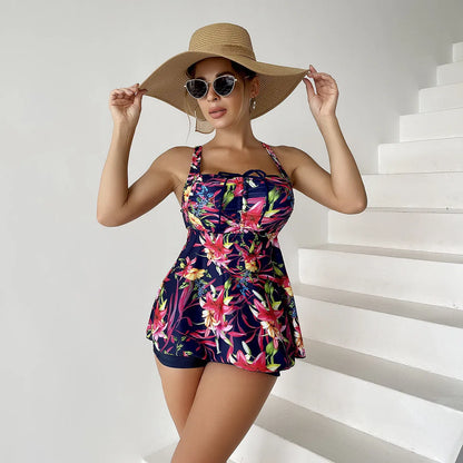 Women's red floral printed skirt style swimsuit with high-waist bikini bottoms.