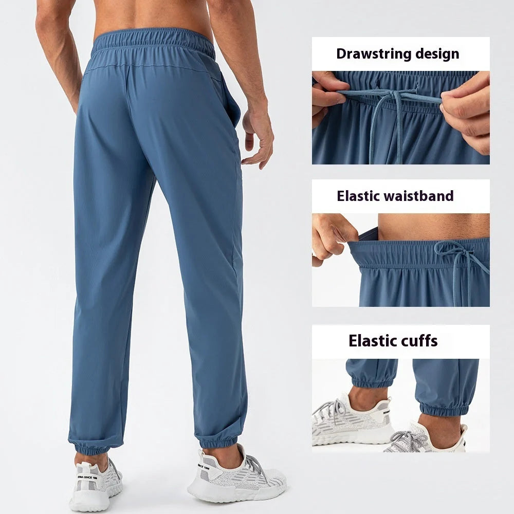 Men's lightweight nylon track pants in various colors, featuring a relaxed, flexible fit for active lifestyles