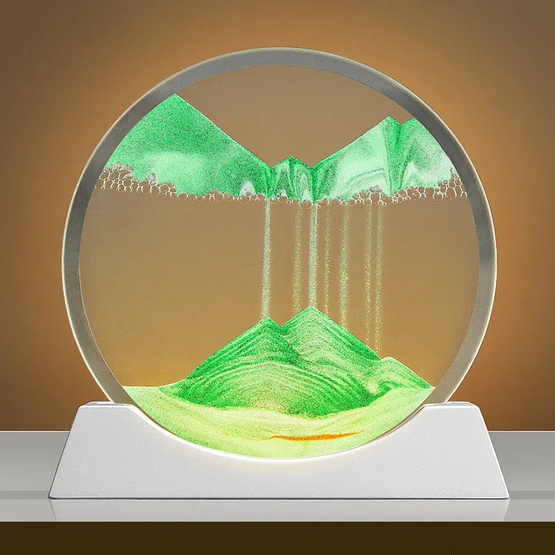 A rotary abstract night lamp with coloured sand falling inside clear glass, showing blue variant.