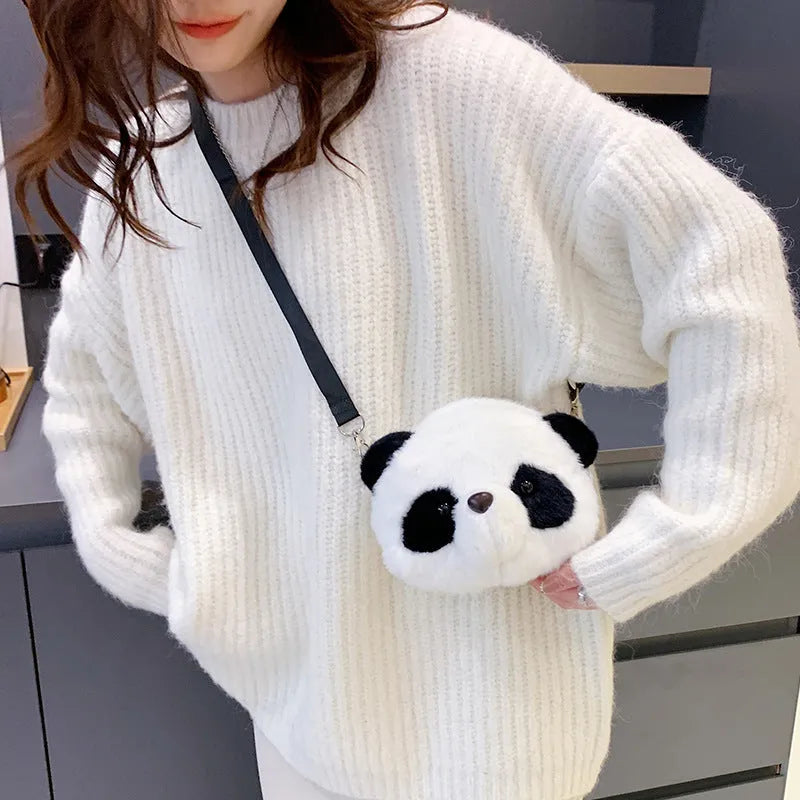 Plush panda head crossbody bag with cylindrical shape measuring 18x15x8cm, showing sandwich pocket and soft texture