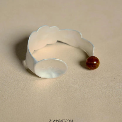 Electroplated alloy ring and bracelet with spoon and pork motifs and diamond shapes