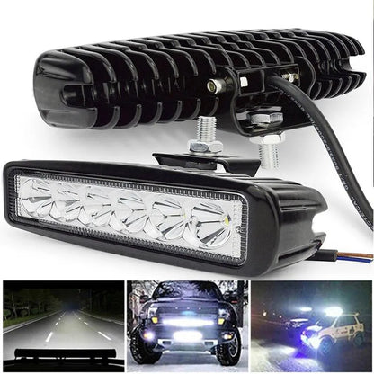 Black car auxiliary light with LED elements and bracket mounting for daytime running applications