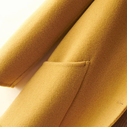 Women's black wool mid-length coat with doll collar and pearl buckle, showing double-faced fabric and 65cm length.