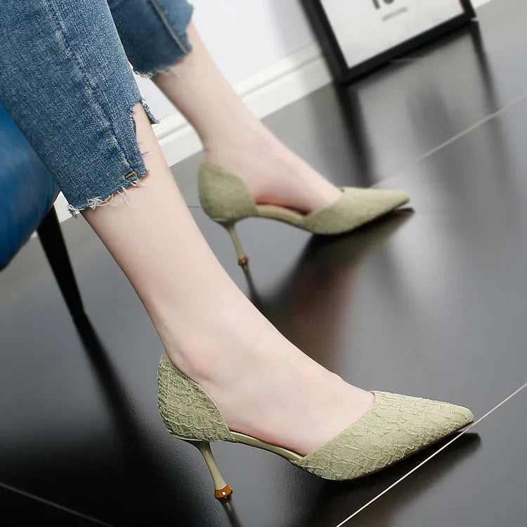 Black pointed-toe stiletto high heel shoes with a 6-8cm heel on a plain background.