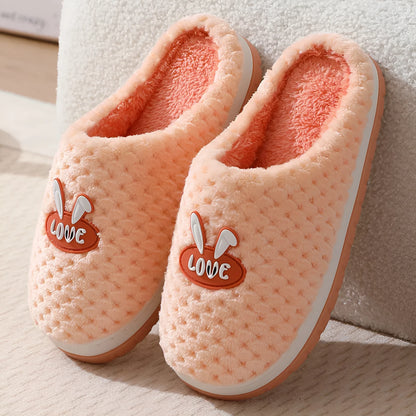 Women's plush rabbit plaid design winter slippers with a thick light-coloured rubber sole.