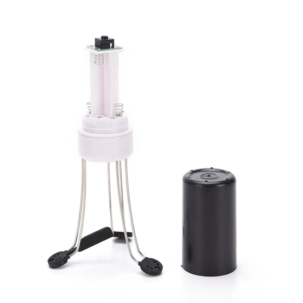 White and black wireless automatic kitchen stirrer with three-speed button, shown next to a saucepan.