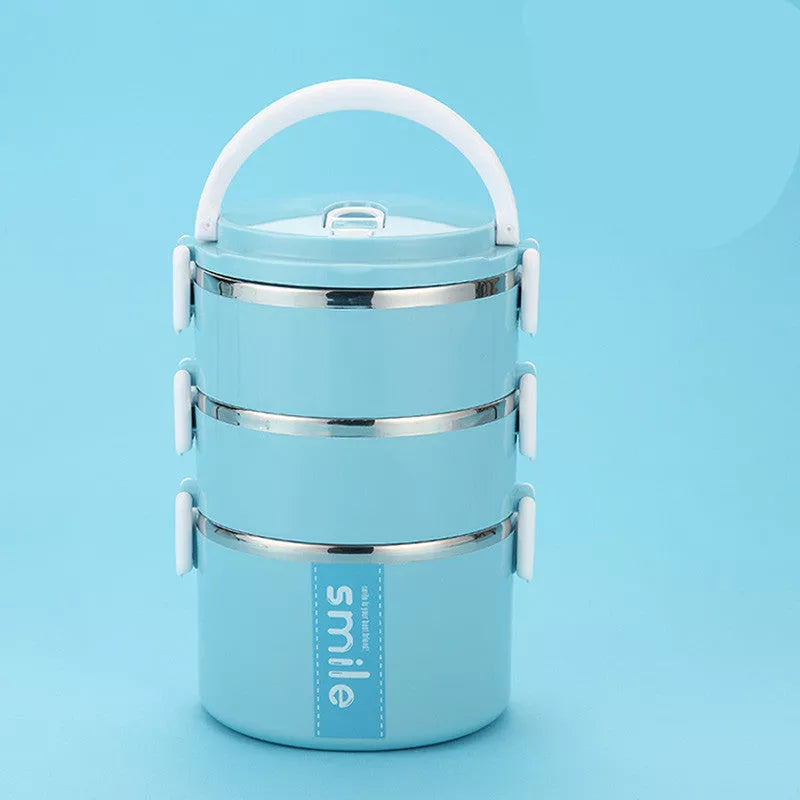 Stainless steel lunch box with built-in spoon, leak-proof design, available in green, pink, and blue