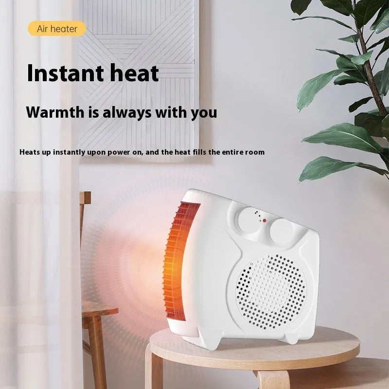 Small white electric heater on desktop with compact dimensions for home or office use