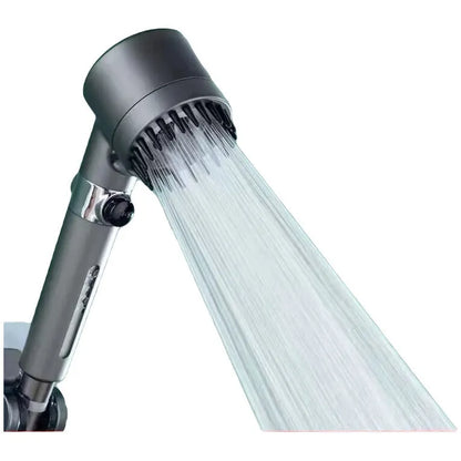 Portable handheld ABS plastic massage shower head with three spray mode settings on a white background.