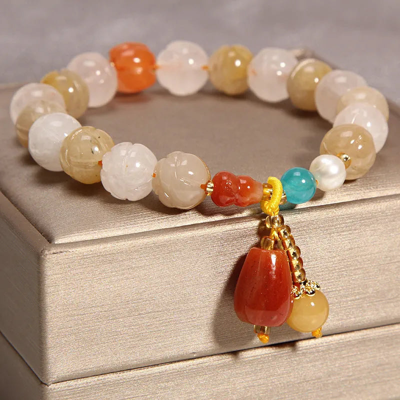 Women's yellow agate crystal bracelet on gold silk cord with Japanese style design