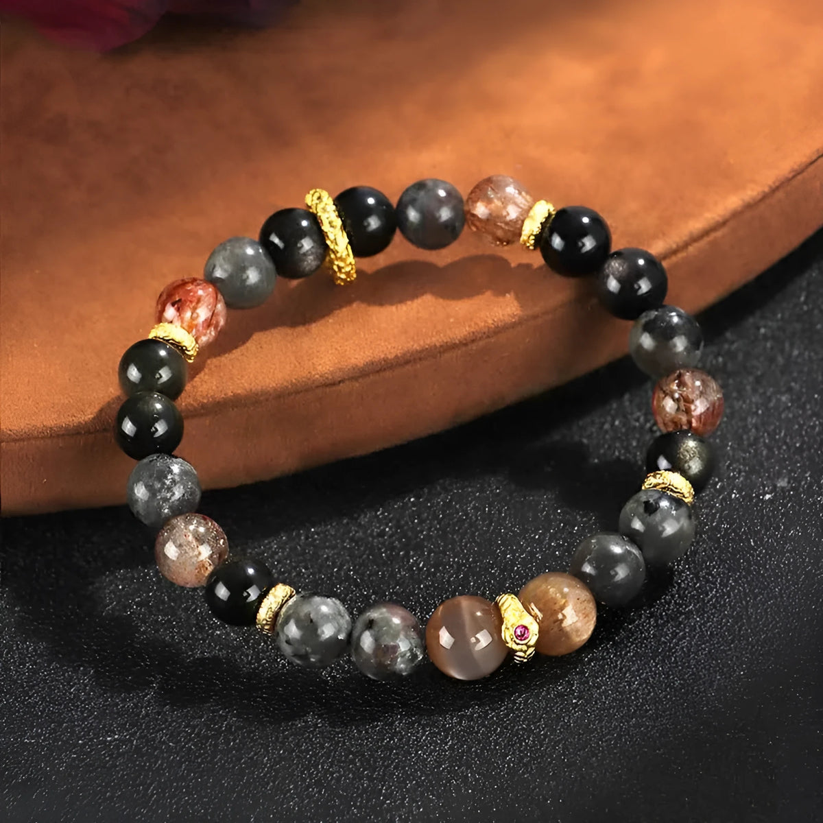 Handcrafted black Sunstone flame stone Wukong bracelet on wrist showing stone bead detail