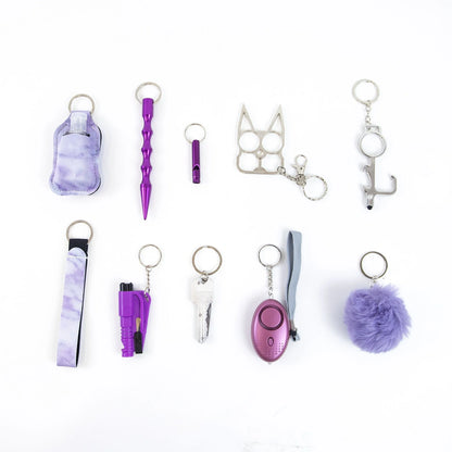 Self-defense keychain set for women with 11 safety tools including alarm and window breaker