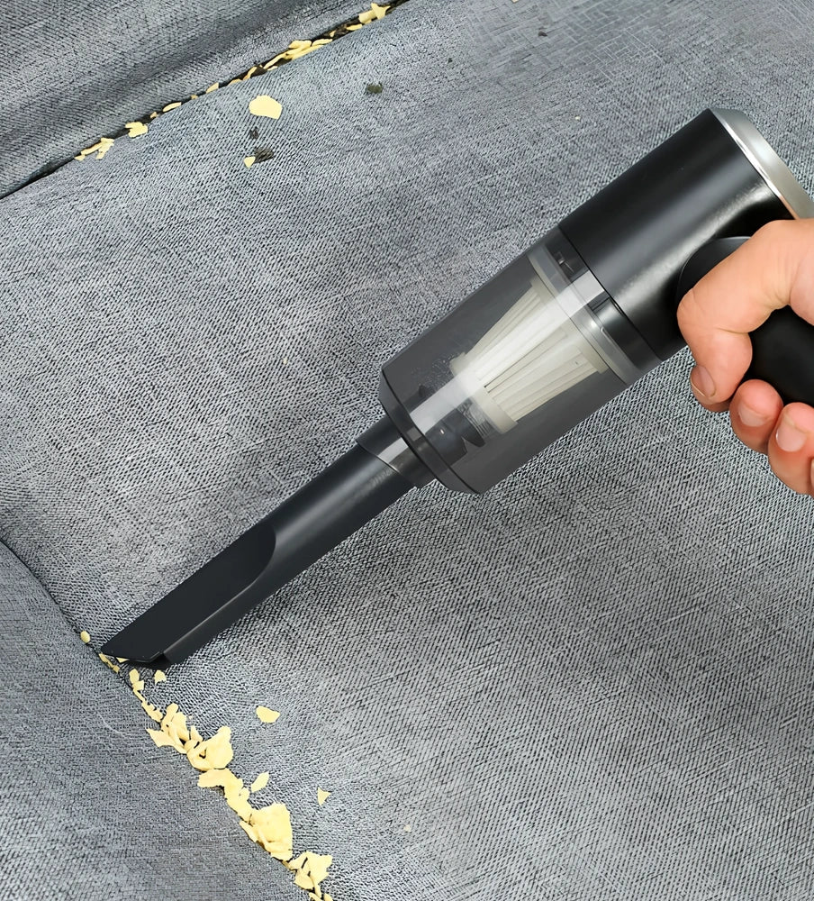 Black cordless car vacuum with suction head and brush attachment, 16.5cm size