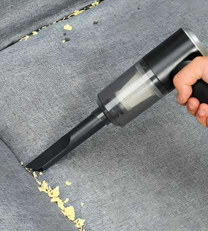 Black cordless car vacuum with suction head and brush attachment, 16.5cm size