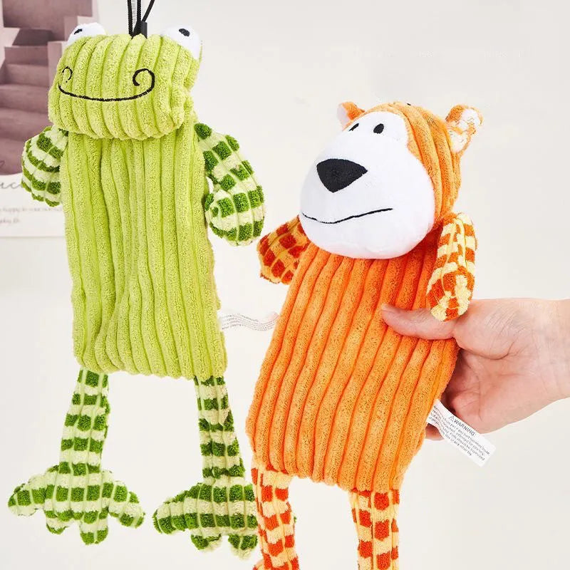 Green and orange plush dog toy with a squeaker for aggressive chewers.