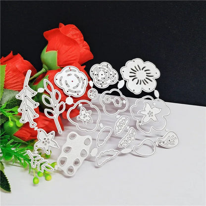 Silver carbon steel flower paper cutting mould measuring 14.3 by 9.9 cm with etched plant design