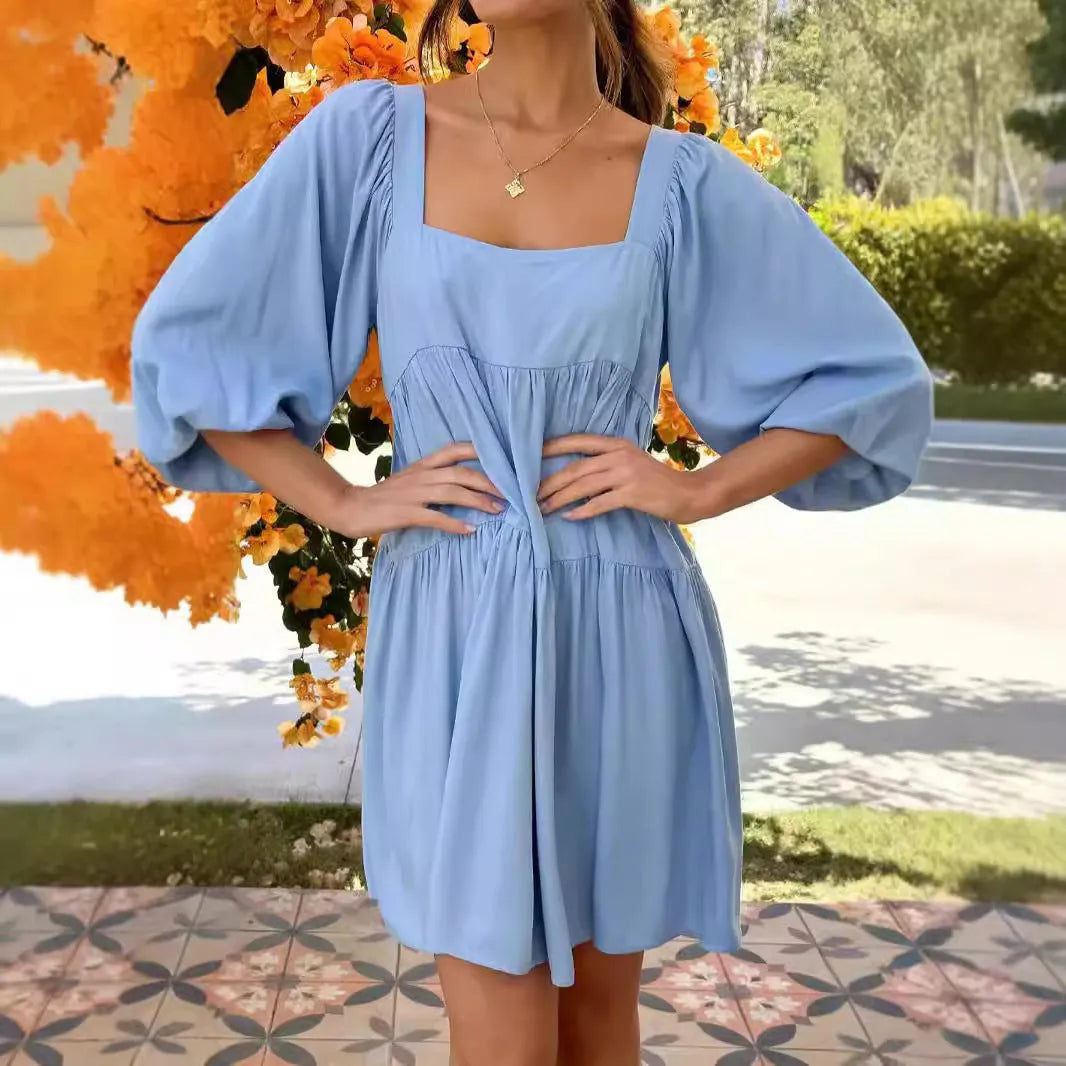 Children's solid colour dress with square collar, puff sleeves, backless design, and A-line skirt in orange or light blue