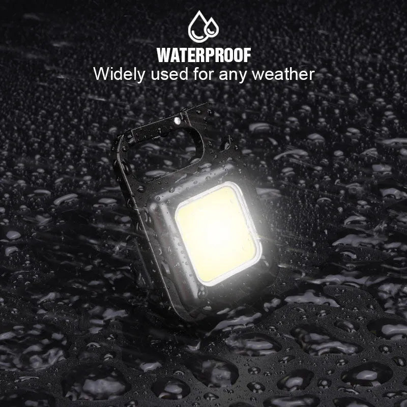 Black aluminium alloy USB rechargeable keychain light with magnetic base and foldable handle