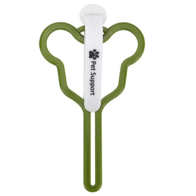 A dog poop bag dispenser with a hands-free clip and adjustable Velcro strap attached to a dog lead.