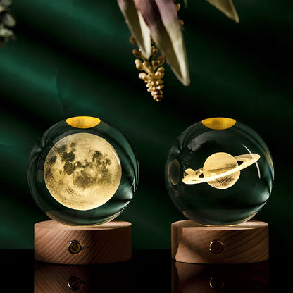 Transparent crystal ball with 3D laser inner carving of galaxy patterns on charging base