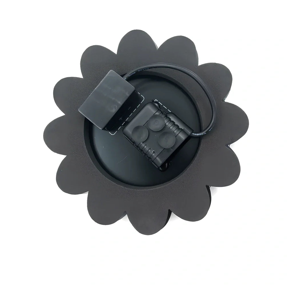 Black solar garden sprinkler with 160mm diameter panel showing adjustable 35-65cm spray height for plant watering