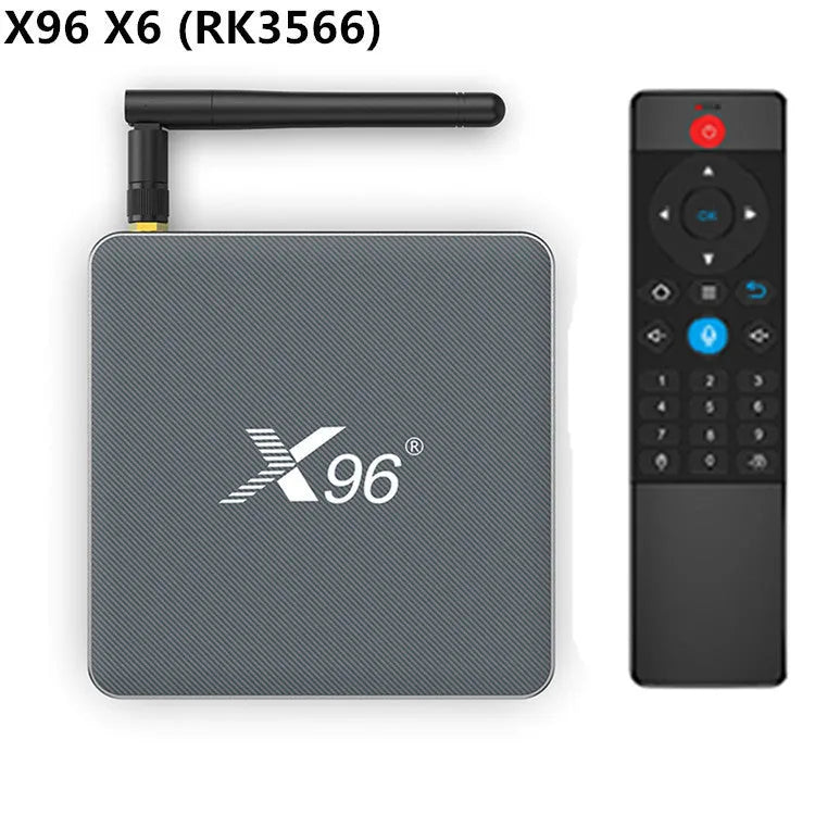 Android smart TV set-top box with remote control and HDMI cable on a wooden surface.