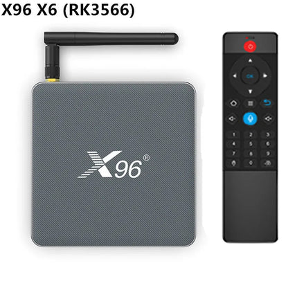 Android smart TV set-top box with remote control and HDMI cable on a wooden surface.