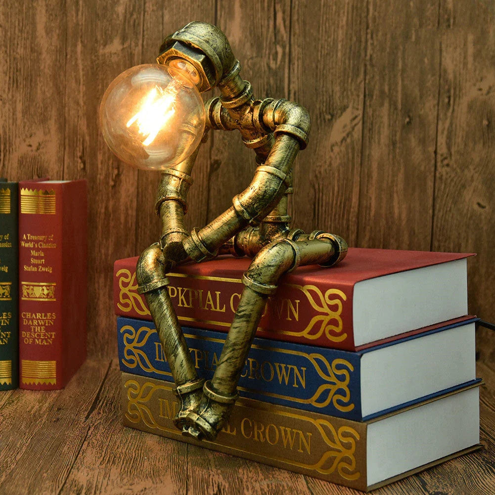 Vintage industrial iron pipe table lamp with soft, warm lighting and a green bronze finish