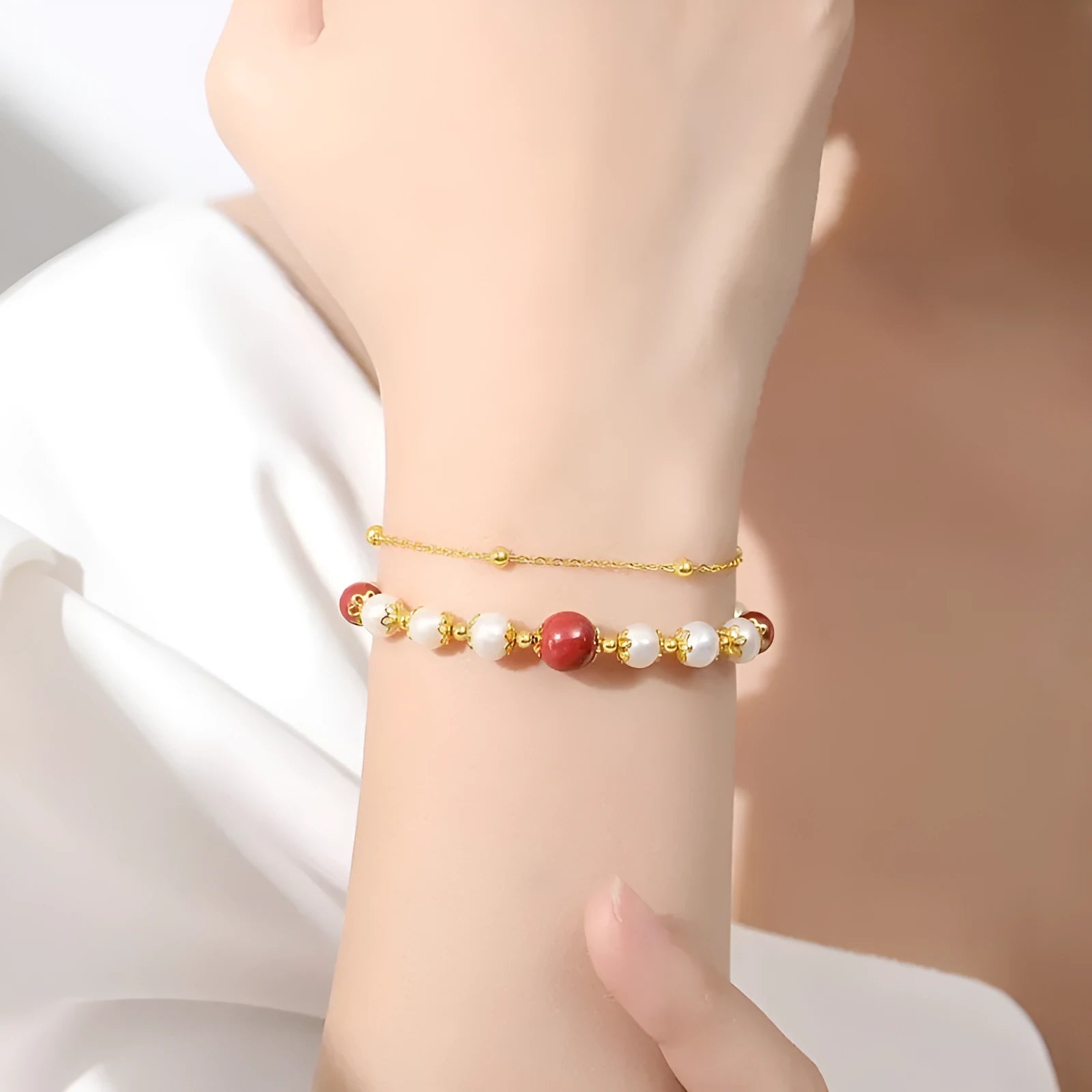Sterling silver double-layer bracelet with freshwater pearls and red cinnabar bean charms