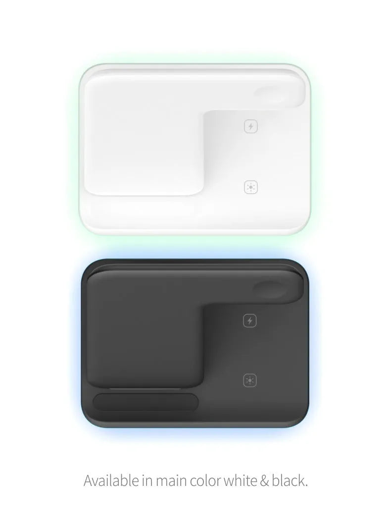 White three-in-one wireless charging stand for mobile phone, watch, and headphones on a desk.