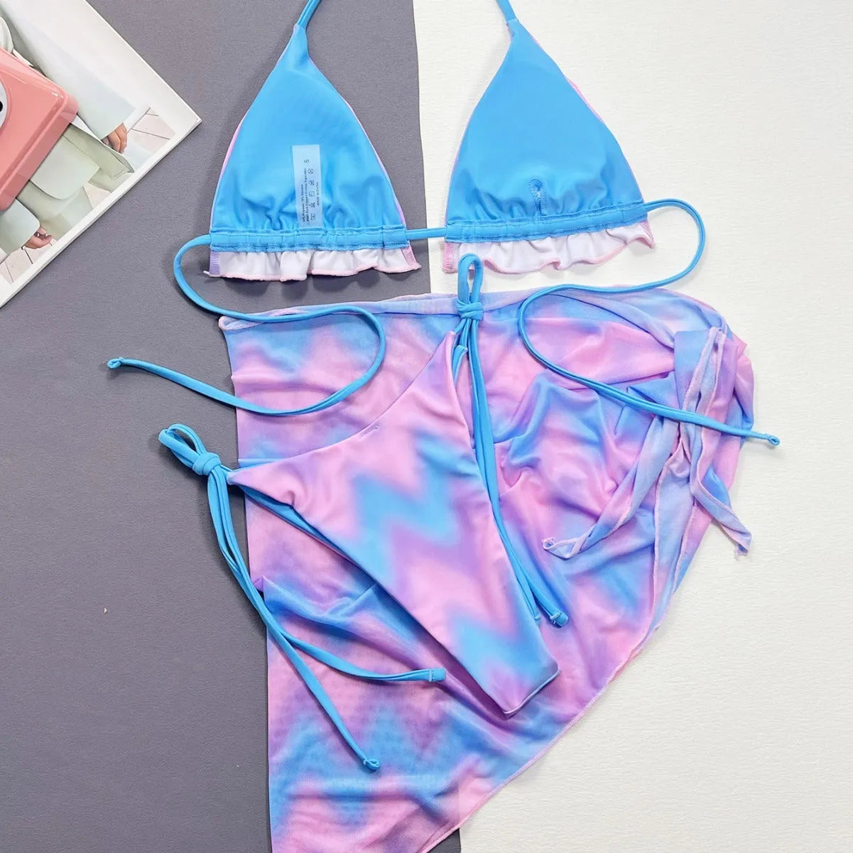 Women's split tie-dye bikini set with skirt, bra, and panties in pictured colour