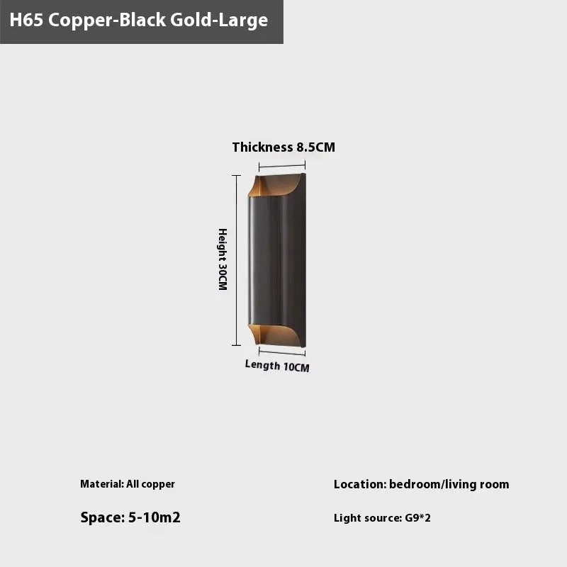 Minimalist copper wall lamp in black gold finish mounted beside bed