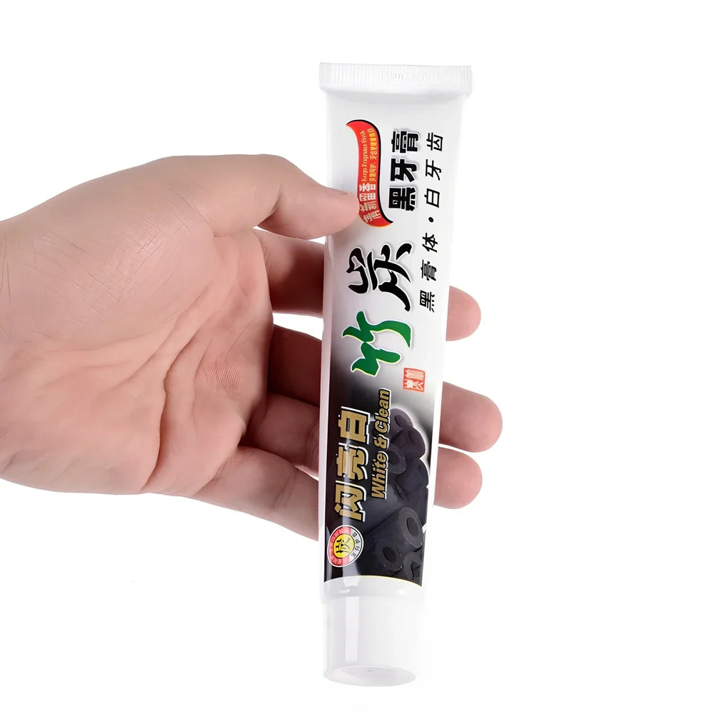 Bamboo charcoal toothpaste tube with black formula for dental stain removal and oral bacteria elimination