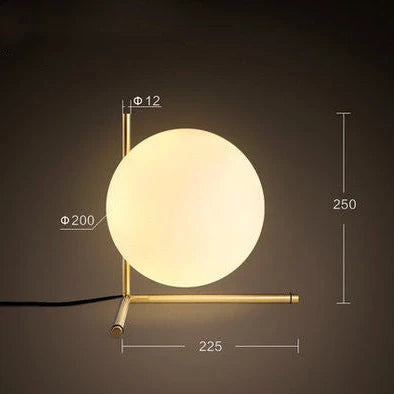 Clear glass spherical table lamp with aluminium base showing dual-colour LED lighting options