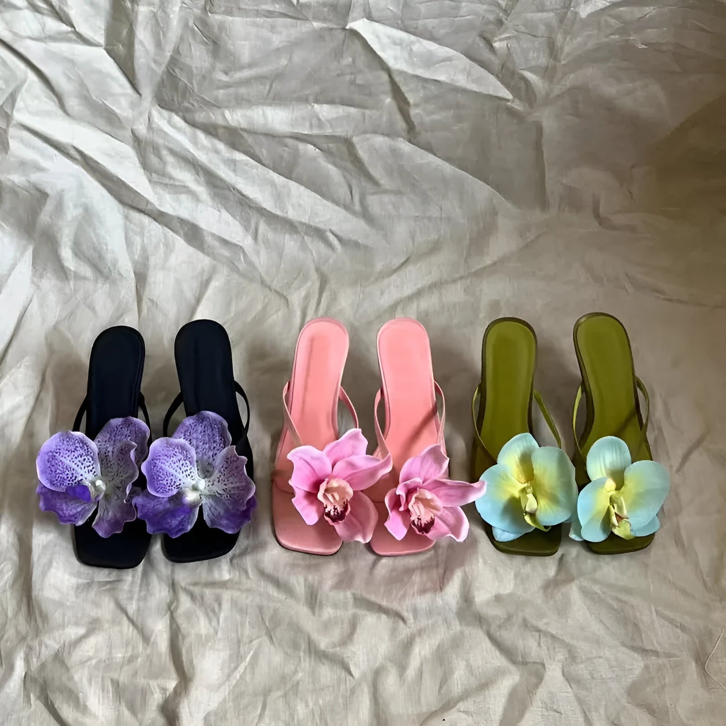 Pink women's flip-flop sandals with artificial Phalaenopsis orchid flower and square-toe design