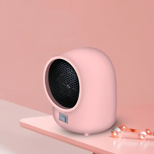Compact pink and white mini heater measuring 18x14x10cm with UK plug