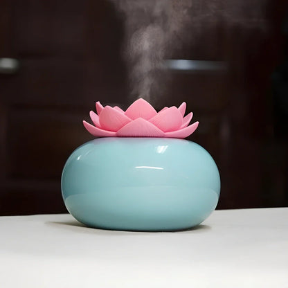 Lotus-shaped aromatherapy humidifier with ceramic base showing green and white colour option