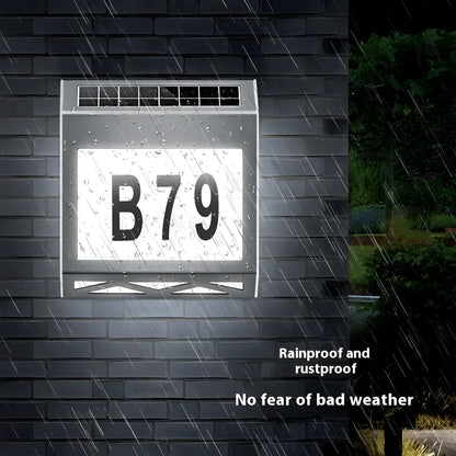 Solar powered outdoor doorplate light with waterproof housing and LED illumination