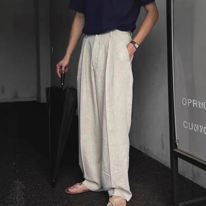 Men's apricot cotton linen trousers with elastic waistband and pencil leg opening on hanger