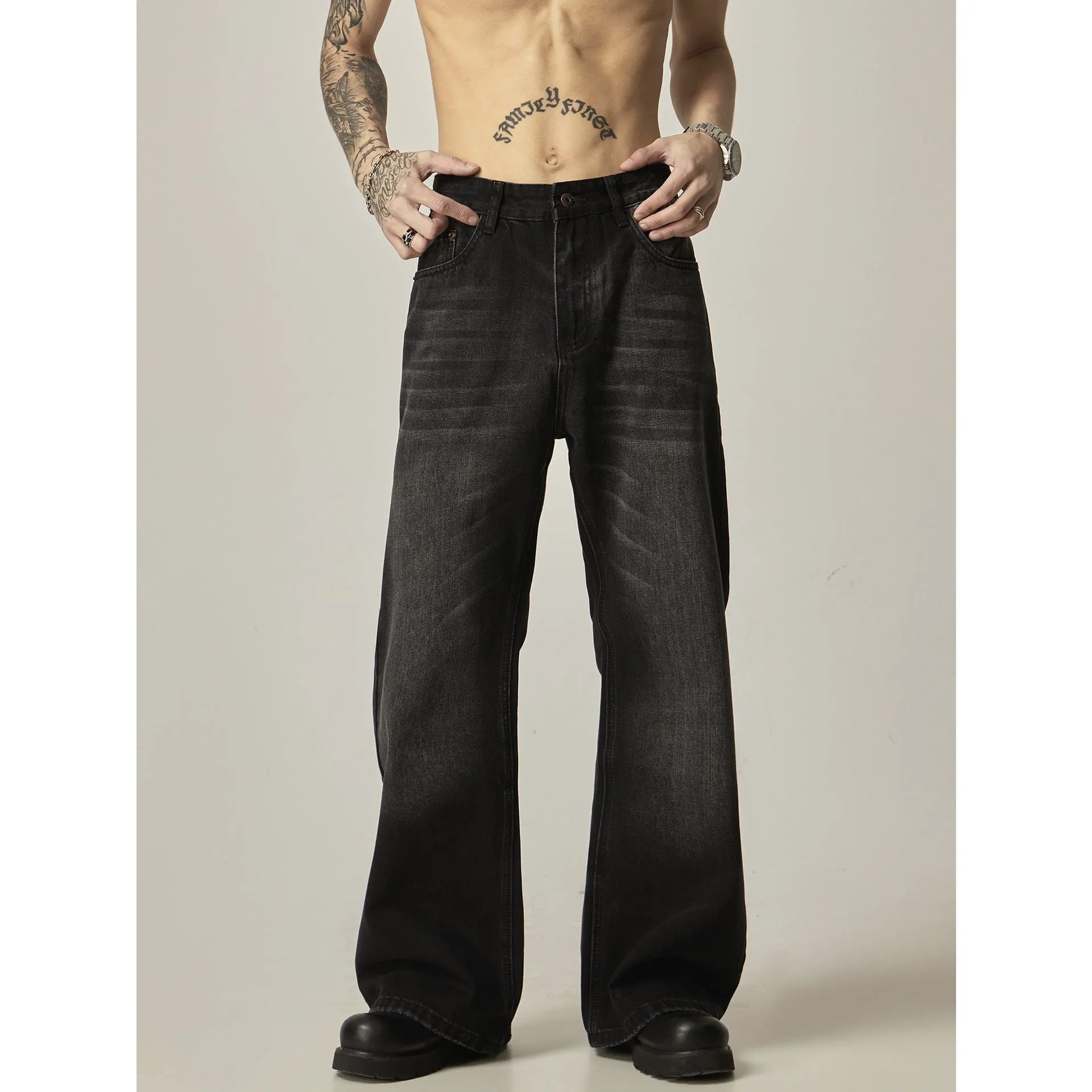 Black loose straight jeans with retro styling, zipper fly, and inelastic denim fabric