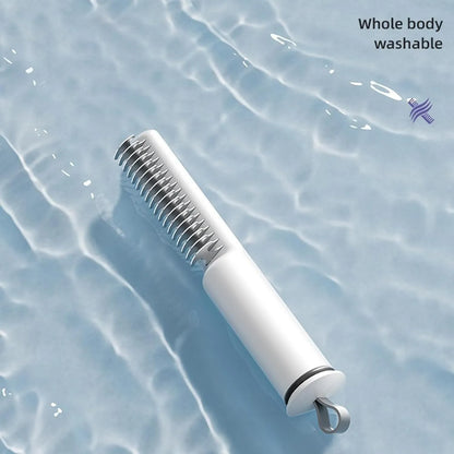 Stainless steel dog dematting comb with ergonomic handle, shown in pink colour on a white background.