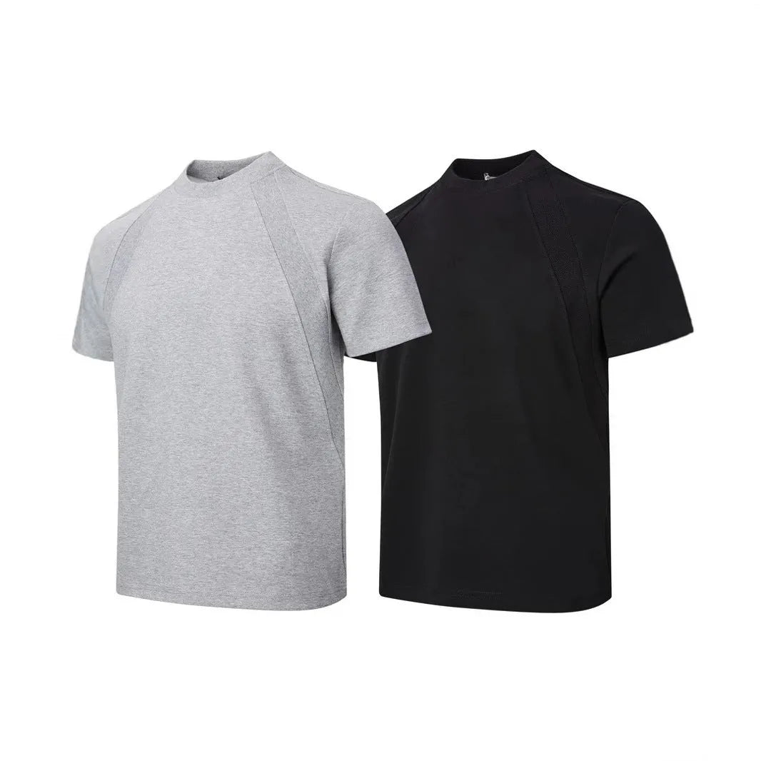 Man's loose fit black short sleeve top with textured air layer stitching detail.