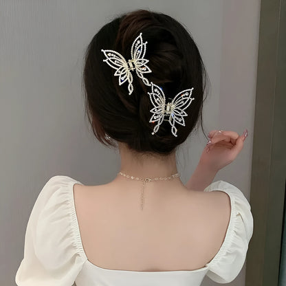 Butterfly-shaped alloy hair clip for women, available in rhinestone or pearl style.