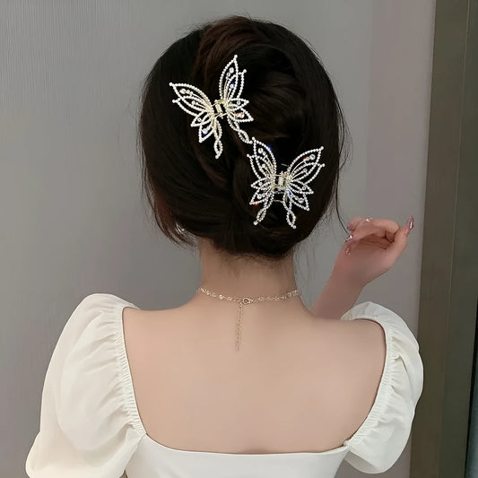 Butterfly-shaped alloy hair clip for women, available in rhinestone or pearl style.