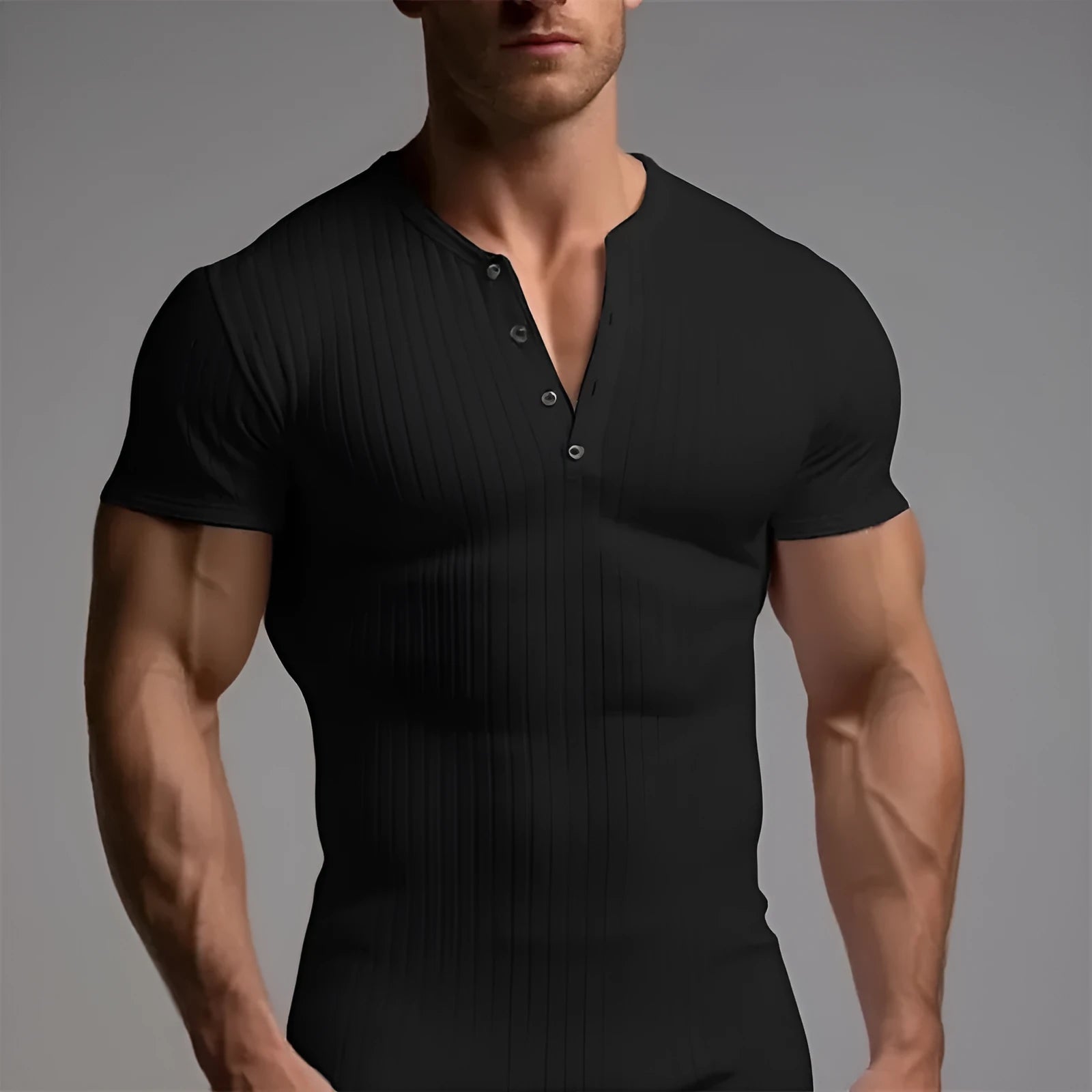 Slim-fitting solid colour sports T-shirt for men on a grey background.