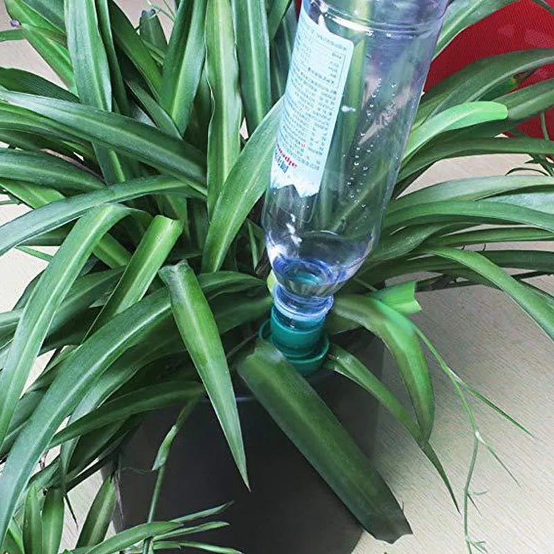 Green ceramic automatic watering dripper device for garden irrigation with cola bottles