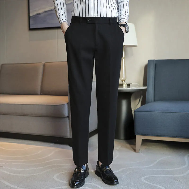 Straight-leg brown corduroy trousers with elastic waistband and slim fit design