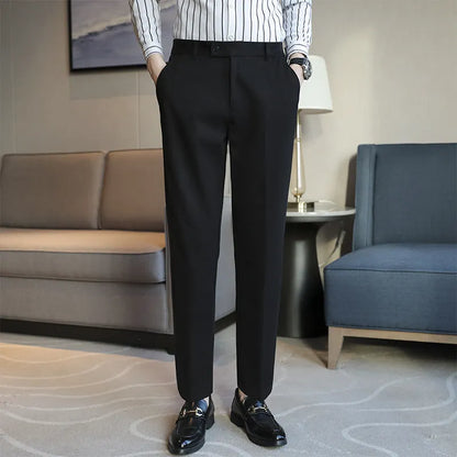 Straight-leg brown corduroy trousers with elastic waistband and slim fit design