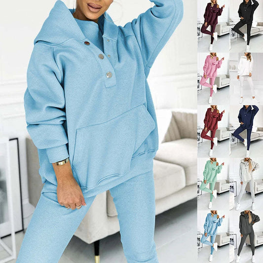 Women's 3-piece sports suit featuring a hooded sweatshirt with pockets and slim trousers