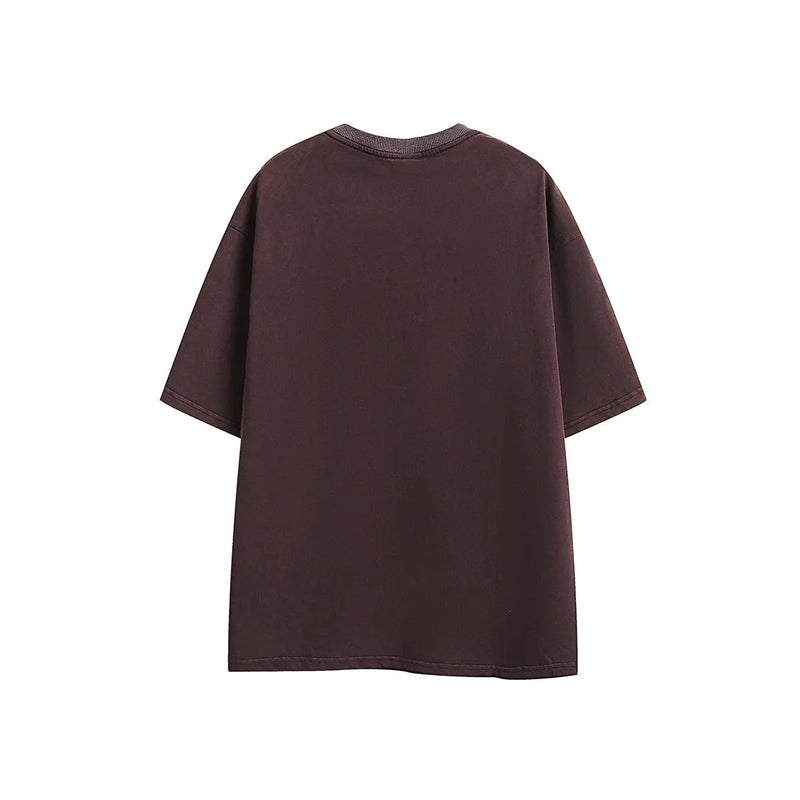 Cotton short-sleeved T-shirt in washed retro style, featuring an embroidered design, available in purple or black. Loose fit pullover for everyday leisure wear, offered in sizes M, L, XL, and 2XL.
